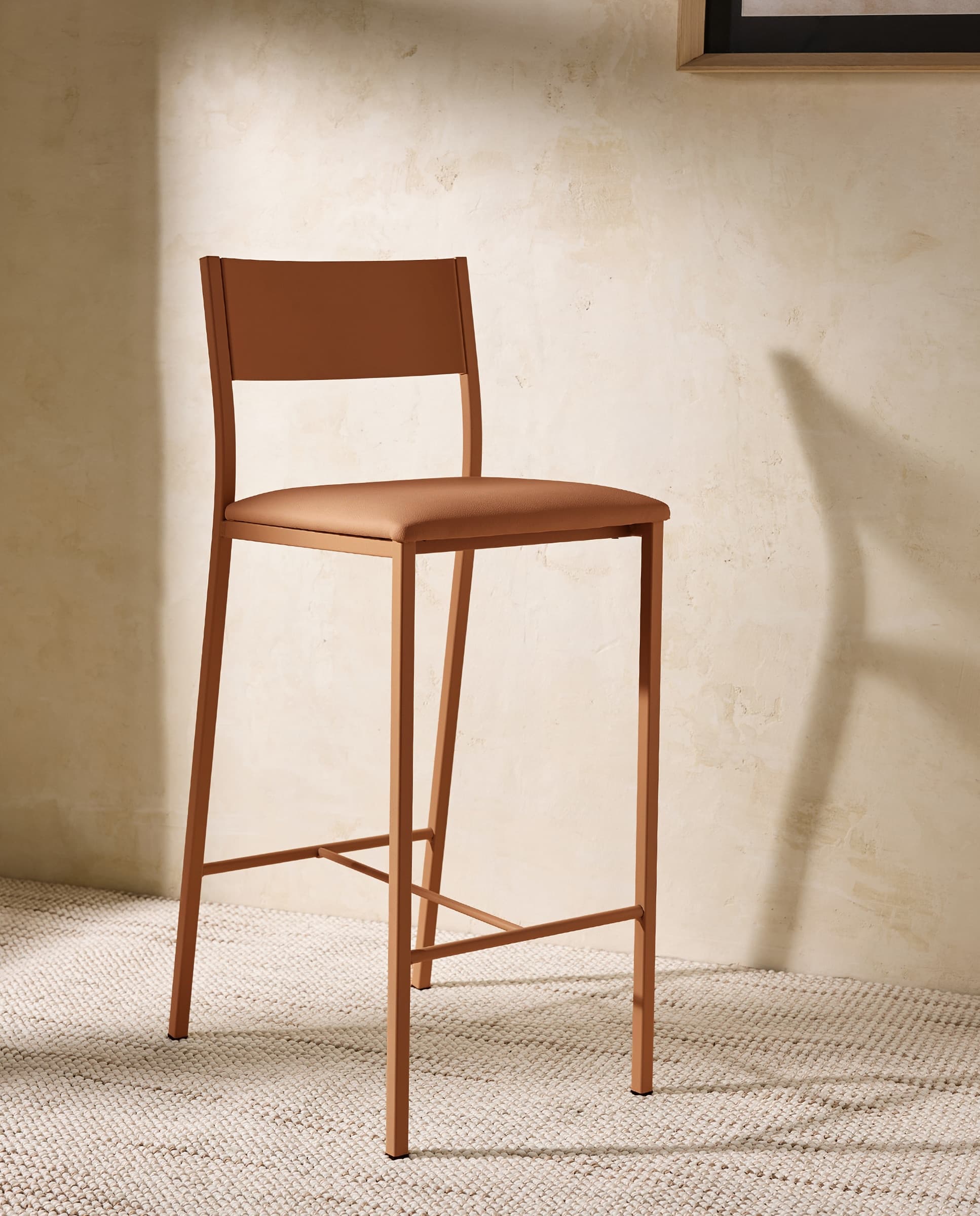 Taburete alto metálico Vania con asiento tapizado