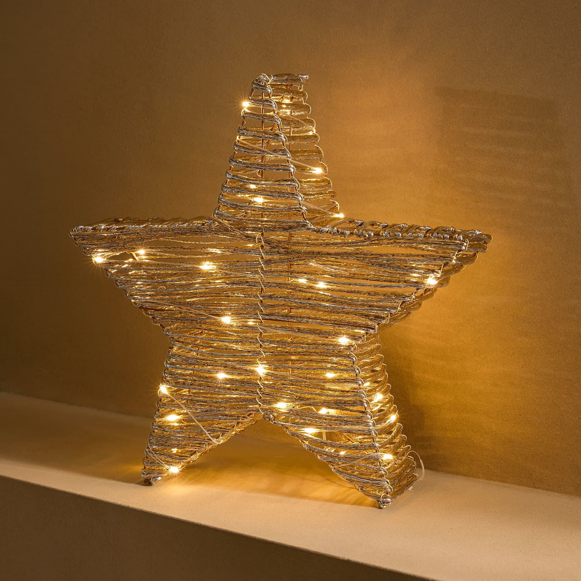 Estrella de mesa decorativa con luz LED dorada