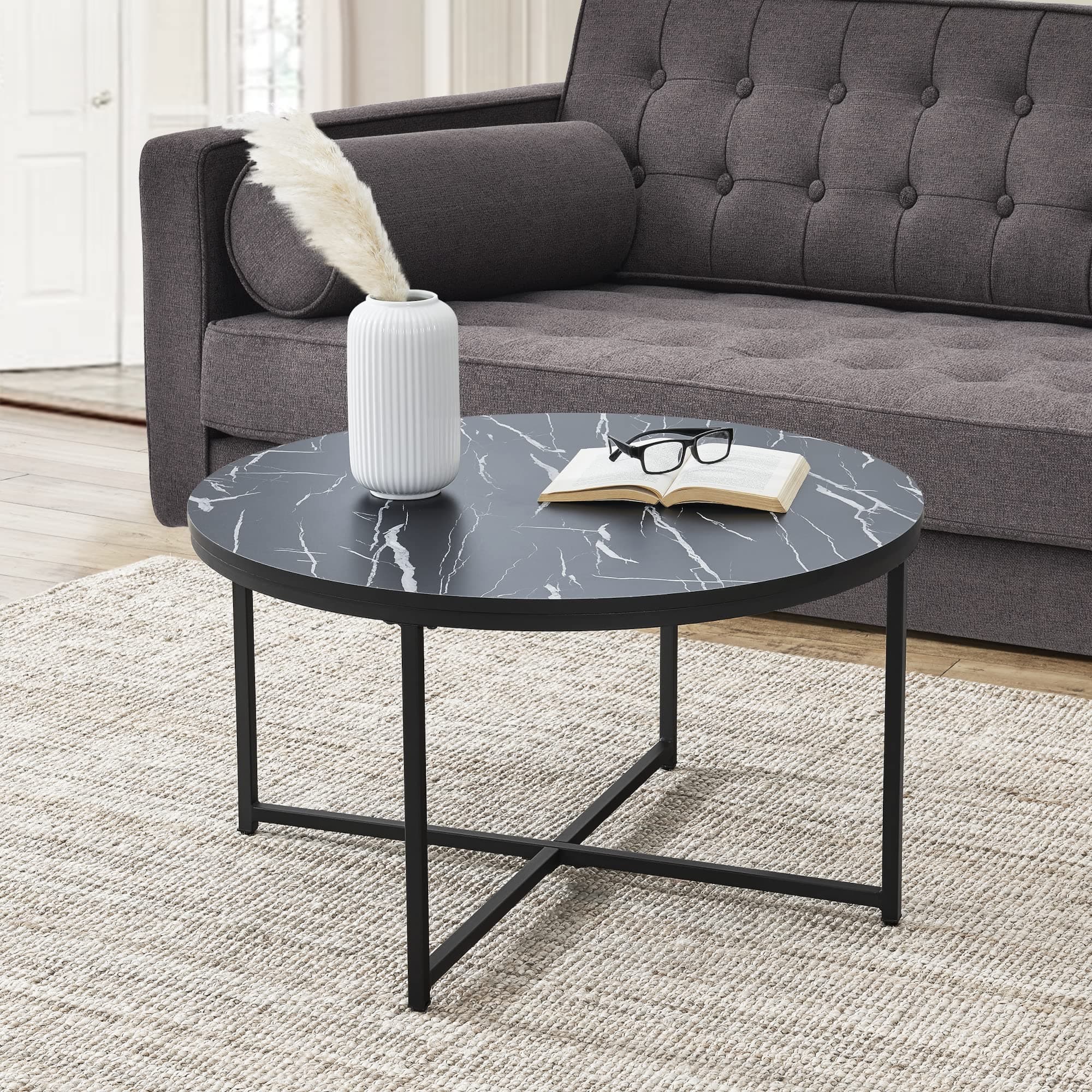 Mesa de centro redonda con tapa de mármol negro
