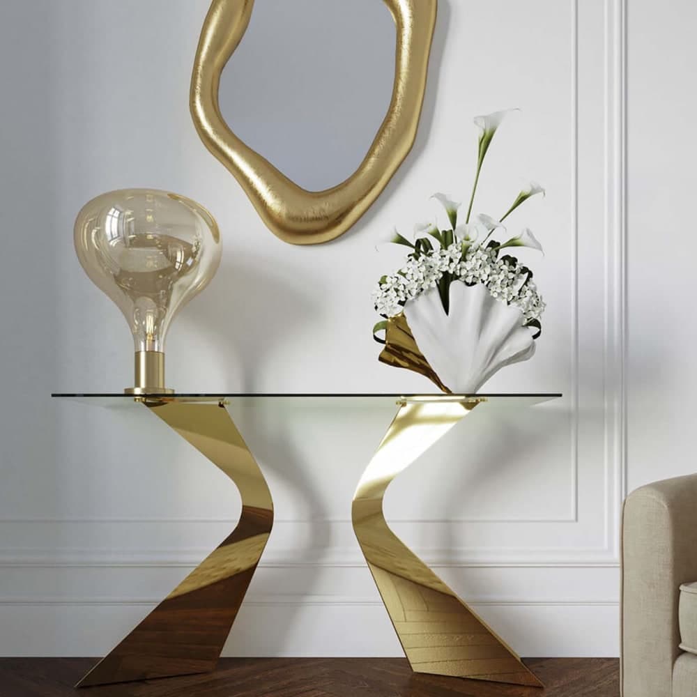 Consola de diseño con patas doradas y sobre de cristal