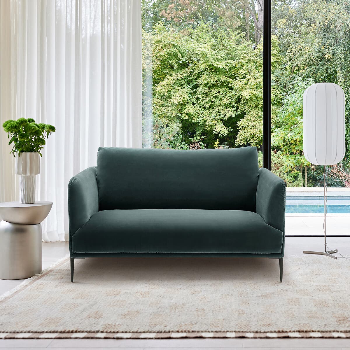 Sofá de terciopelo verde oscuro moderno