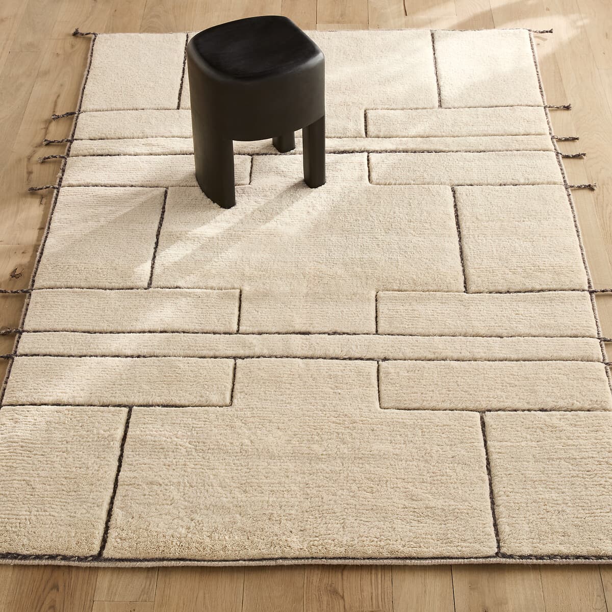 Alfombra geométrica de lana beige