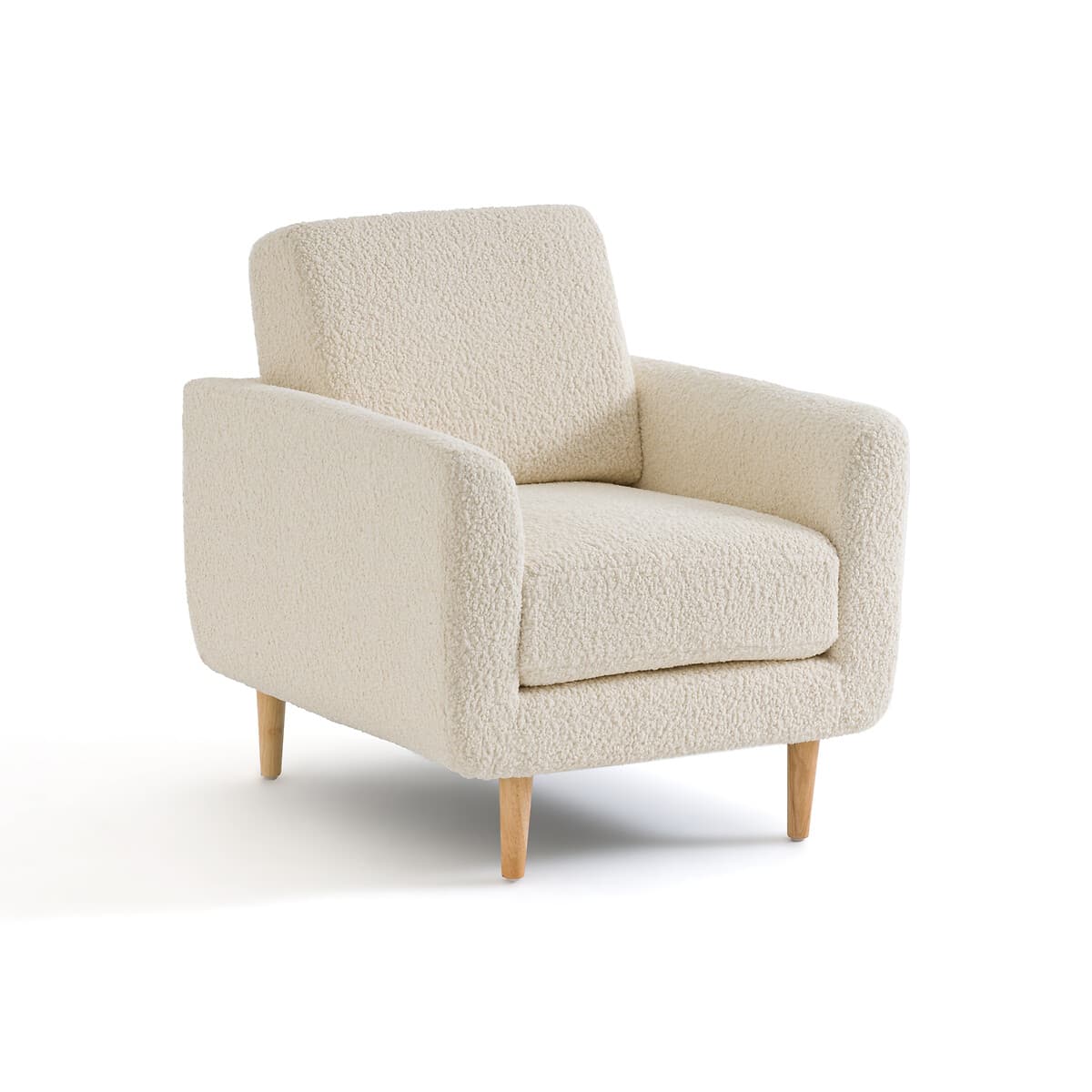 Sillón tapizado en tela bouclé color crema