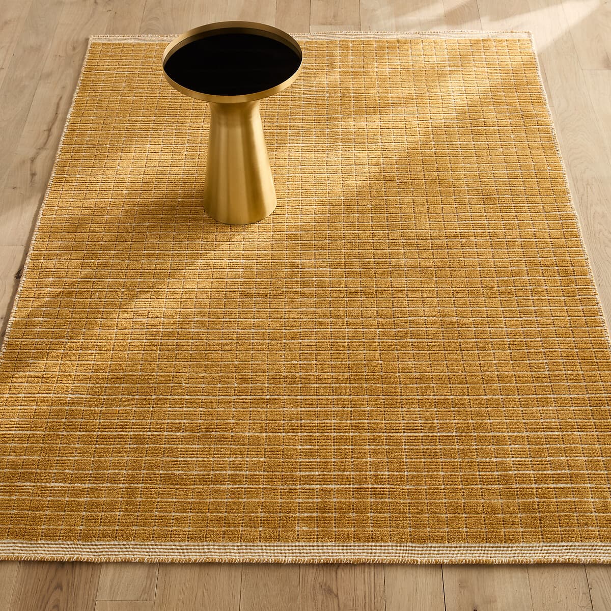 Alfombra de algodón con diseño a cuadros dorada