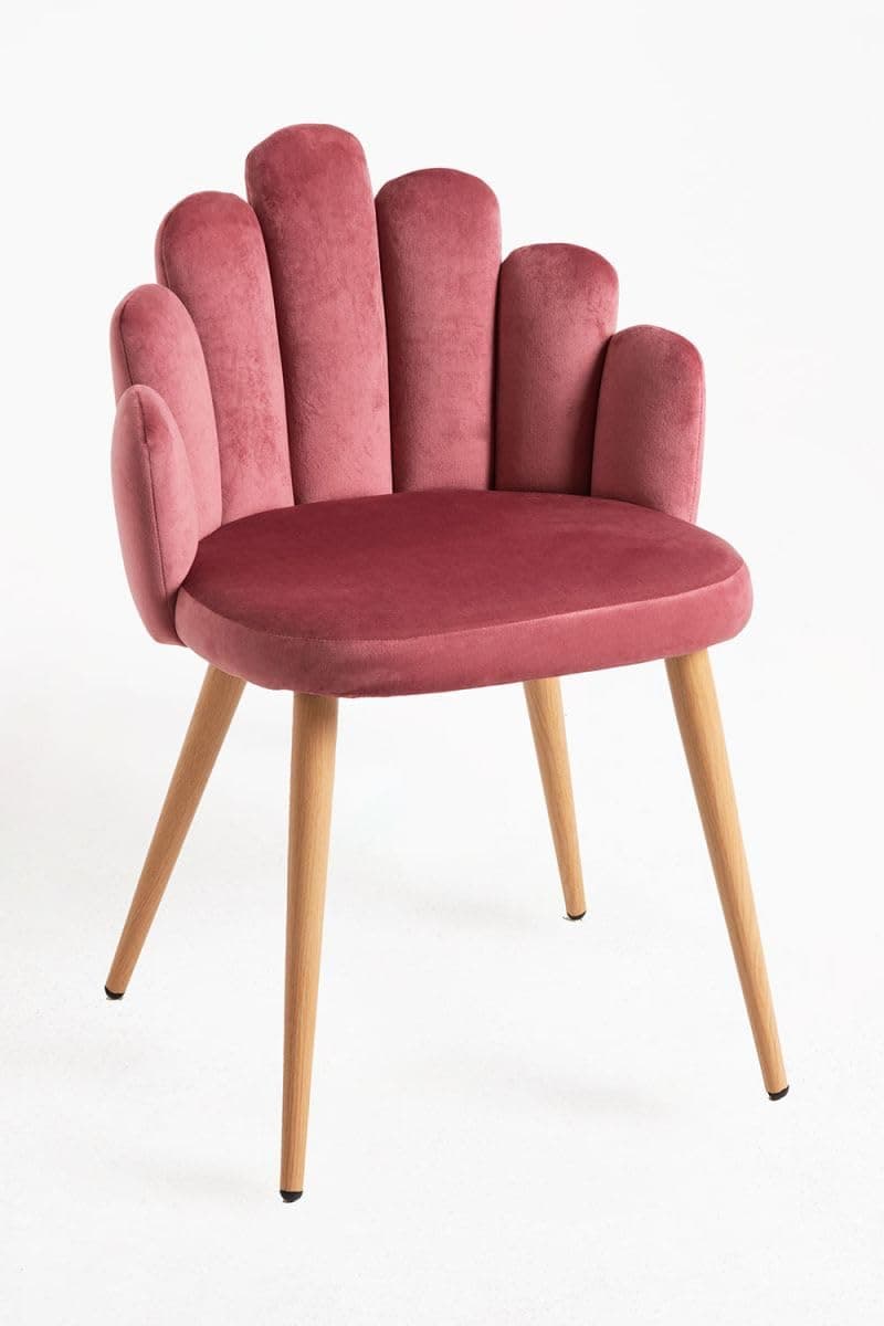 Silla de terciopelo rosa con respaldo de concha
